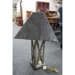 A contemporary mirrored table lamp with leather look shade