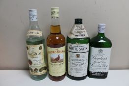 Four bottles of alcohol - Gordons Special dry London gin, White Satin London gin,