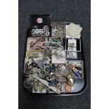 A tray of assorted costume jewellery including necklaces, cameo brooch,