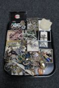 A tray of assorted costume jewellery including necklaces, cameo brooch,