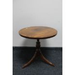 A reproduction mahogany occasional table