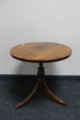 A reproduction mahogany occasional table