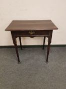 A George III oak side table fitted with a drawer,