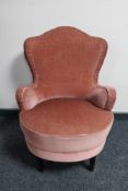 A mid 20th century bedroom chair in pink dralon