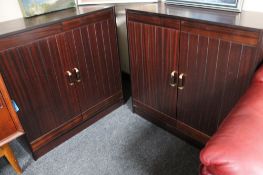 A pair of mahogany effect double door cabinets