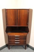 A mid 20th century double door corner cabinet