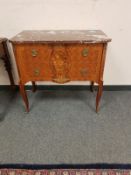 A continental walnut marble topped two drawer chest,