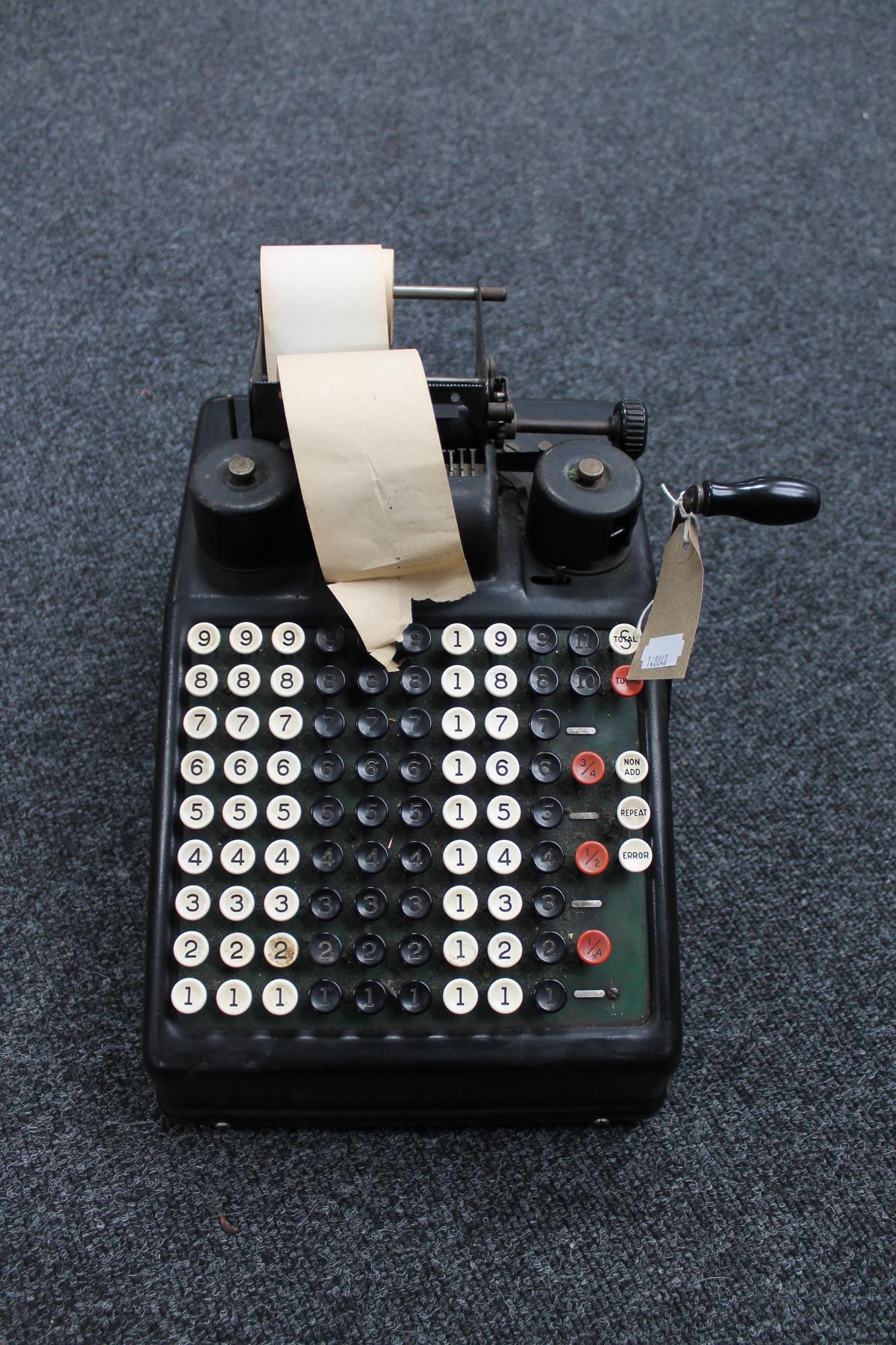 A vintage American Burrough's Portable adding machine
