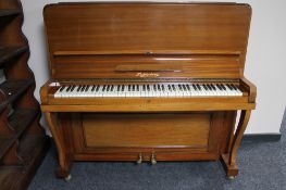 A mahogany cased upright piano by Schonberg