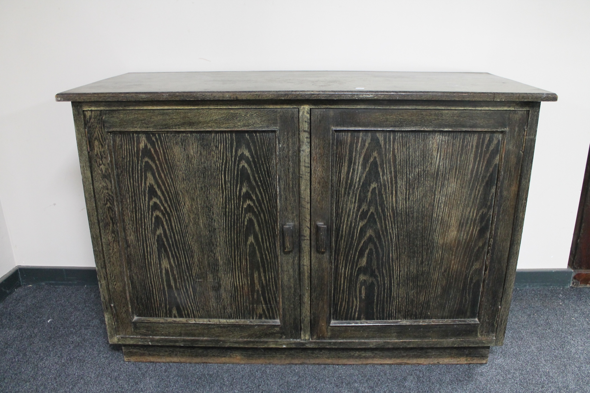 An oak double door cabinet