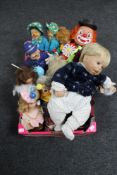 A box of porcelain headed dolls, clown dolls, laughing policeman,