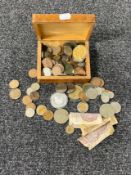 A carved wooden trinket box of pre decimal, Victorian and Georgian coins, 10 shilling bank note,