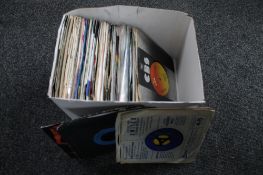 A box of 7" singles mainly rock