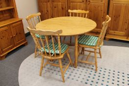 A Dinette drop leaf kitchen table and four spindle back chairs