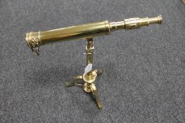 A brass tripod telescope stamped Ross London