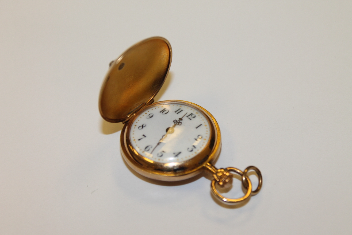 An 18ct gold fob watch set with rose cut diamonds