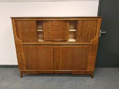 A mid 20th century stained beechwood sideboard,