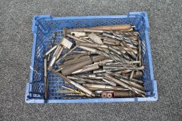 A basket of industrial drill bits and tap and dies