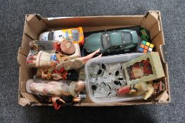 A box of tourist dolls, die cast cars, Rubix cube,