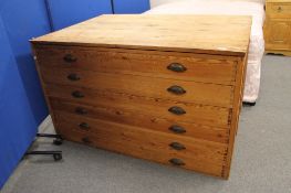 An antique pine six drawer plan chest CONDITION REPORT: 137cm wide by 91cm deep by