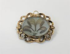 A gold Victorian memoriam brooch CONDITION REPORT: 54mm by 46mm.