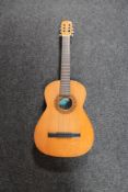 A Spanish BM Clasico semi acoustic guitar