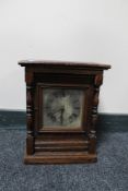 A continental oak cased bracket clock with silvered dial