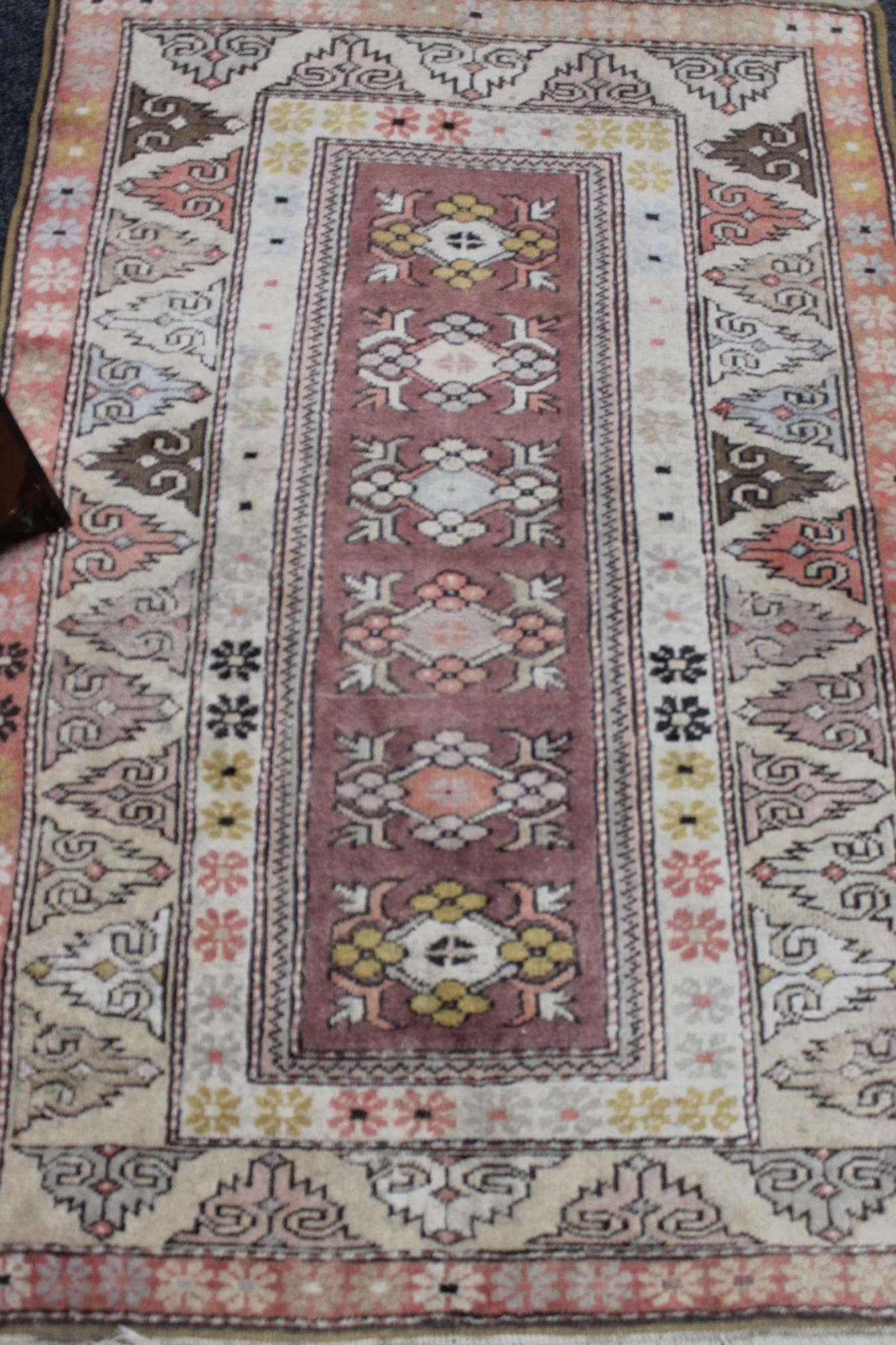 A fringed Persian rug