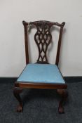 A child's Hepplewhite style dining chair on claw and ball feet with blue fabric seat