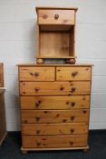 A pine seven drawer chest and a pine bedside stand
