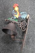 A cast iron cockerel bracket with bell