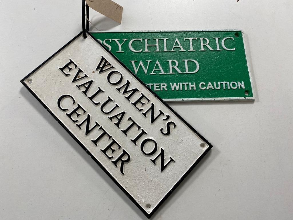 Two cast iron signs - Psychiatric ward and evaluation centre