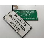 Two cast iron signs - Psychiatric ward and evaluation centre