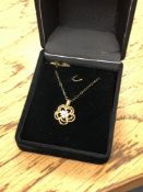 A 10ct gold diamond set pendant on chain