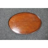 An oval Victorian mahogany serving tray