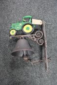 A cast iron tractor bracket with bell