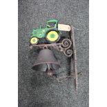 A cast iron tractor bracket with bell