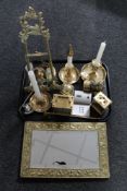 A tray of ornate brass easel frame, brass chamber sticks, mantel clocks etc,