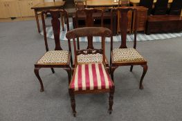 An antique mahogany dining chair and three Queen Anne style chairs
