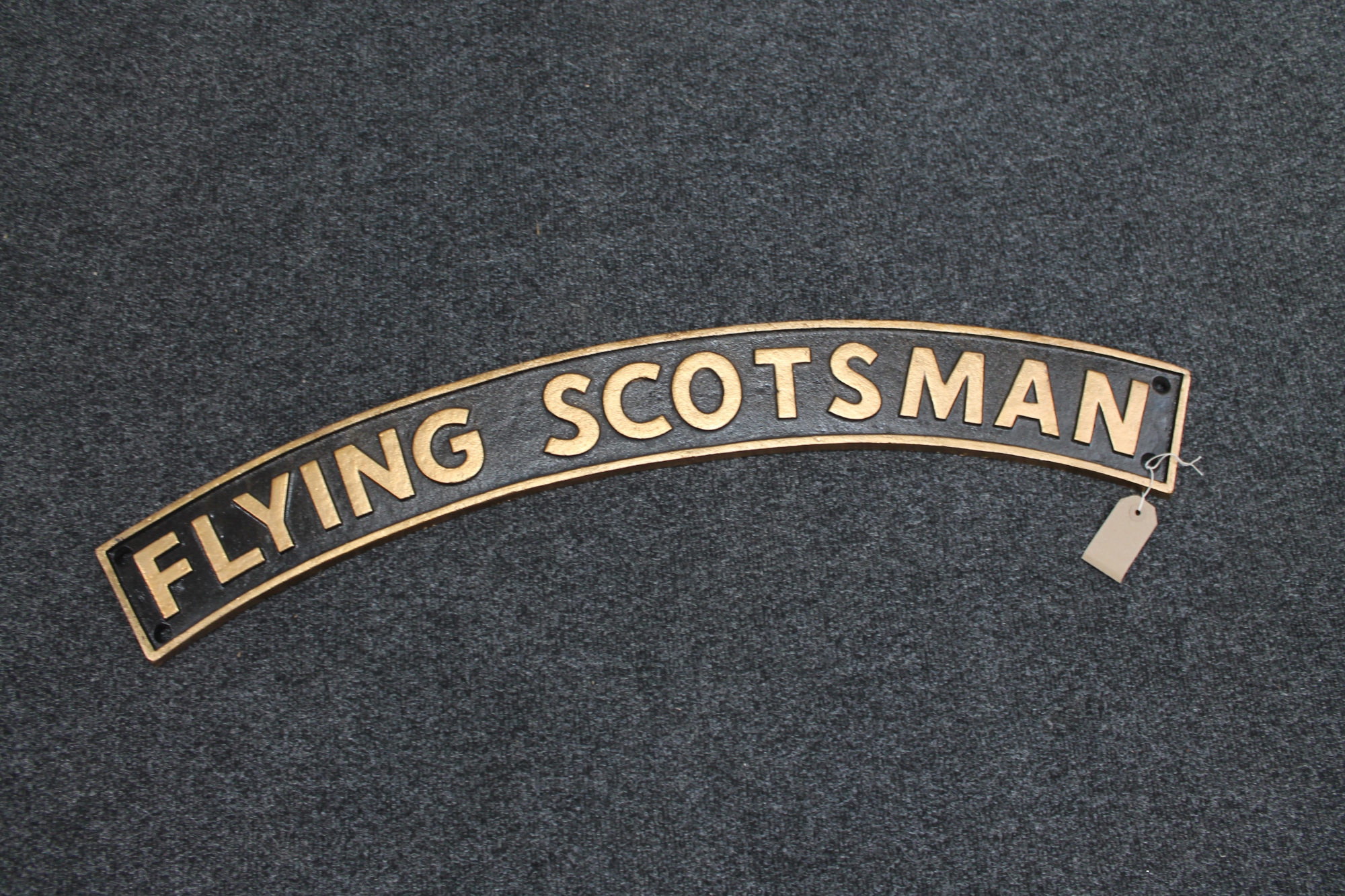 A cast iron plaque The Flying Scotsman