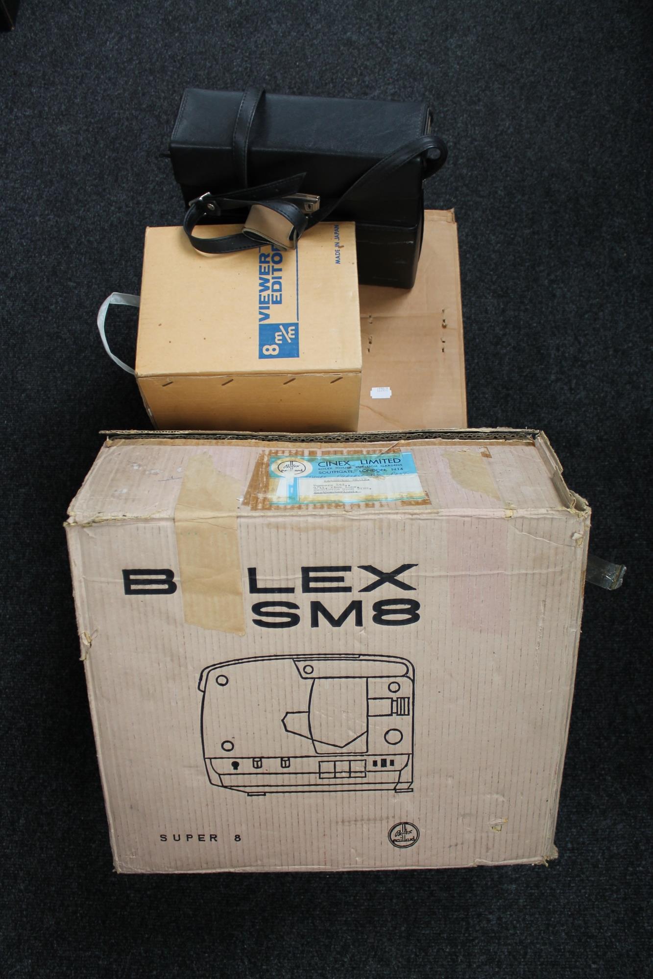 A boxed Gnome slide projector, video editor,