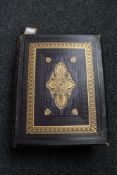 An antique leather bound bible with colour lithographic plates