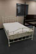 A 4' white metal bed frame and Visco Comfort mattress