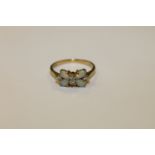 An 18ct gold opal and diamond ring