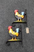 Two cast iron cockerel wall brackets