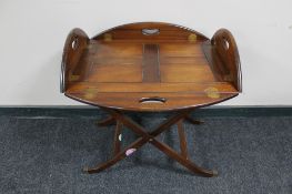 A mahogany flap sided butler's tray on stand