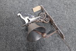 A cast iron sheep dog bracket with bell