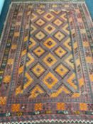 A fringed Persian kilim rug of geometric design