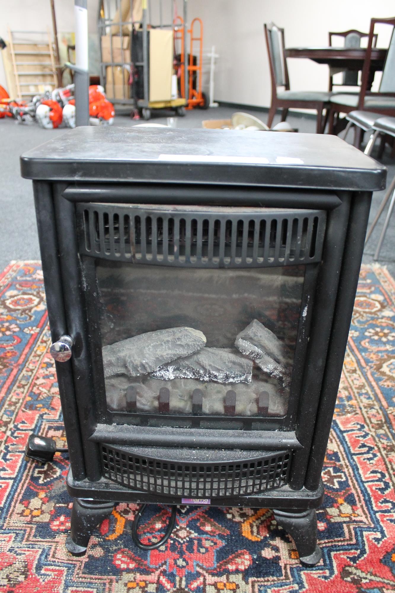 A By Flame electric fire in the form of a stove