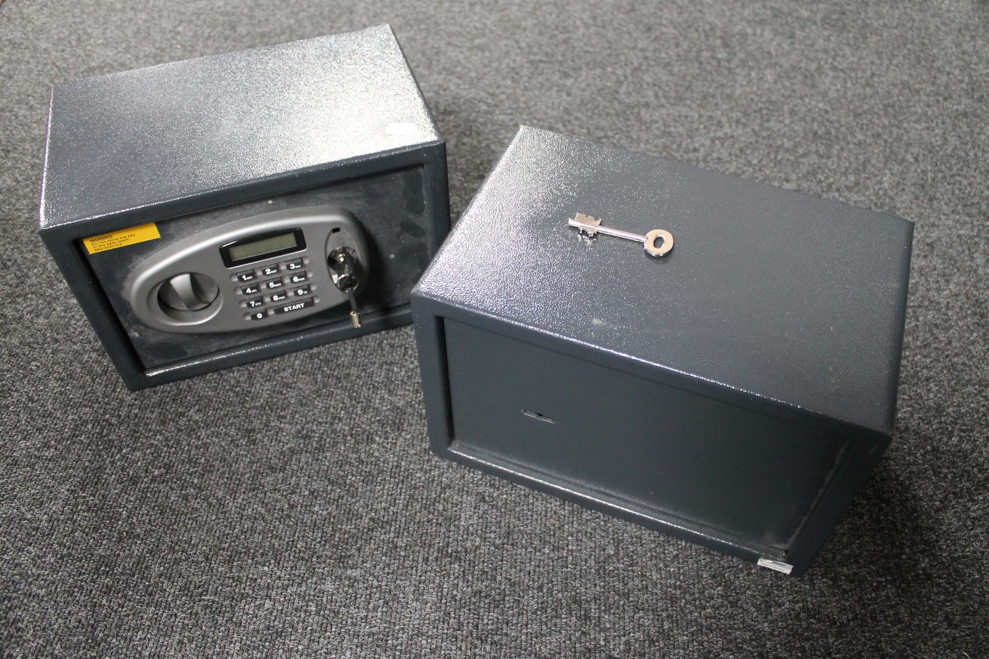 A small metal safe and an electronic safe